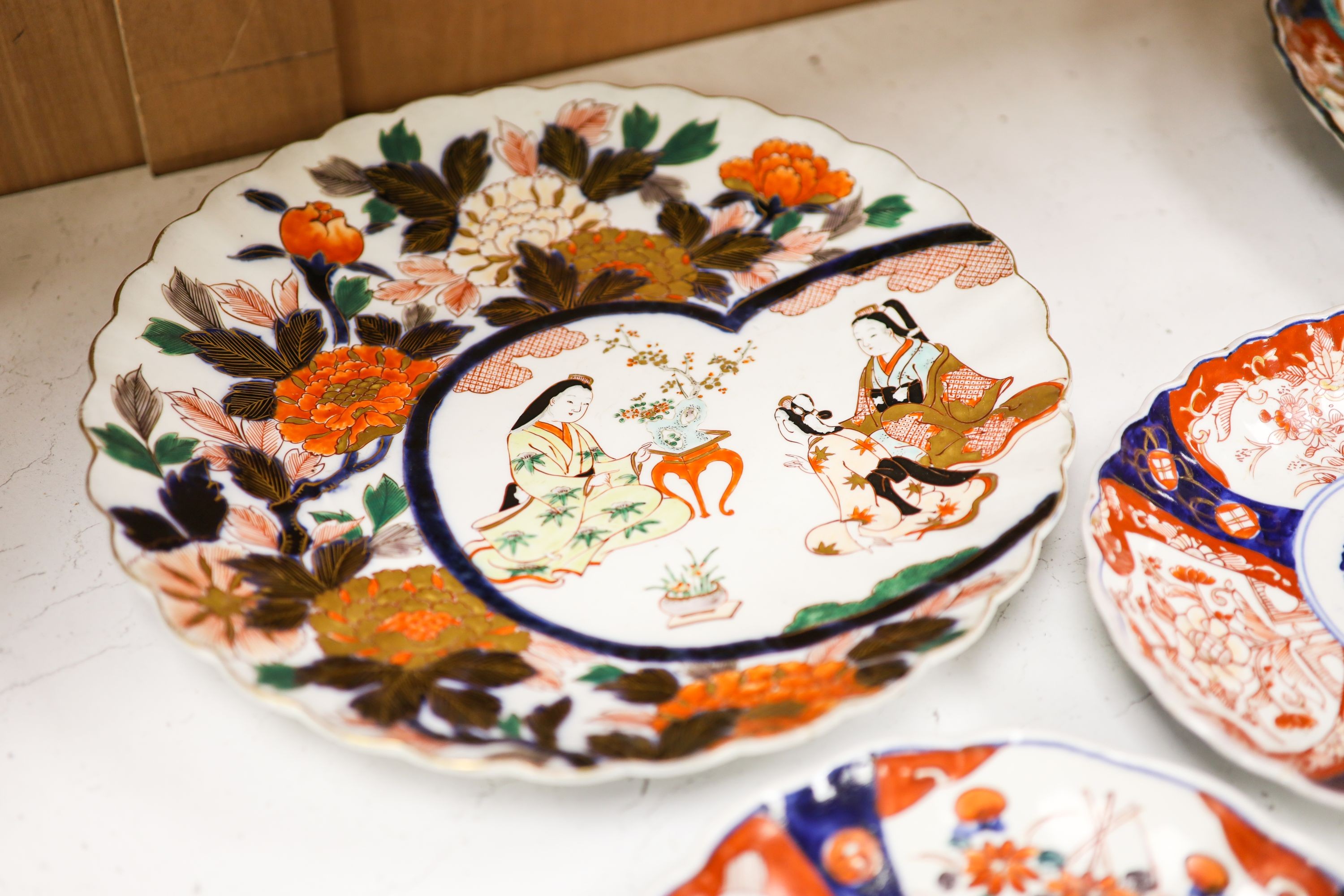 Five Japanese Imari dishes, largest 30.5 cm
